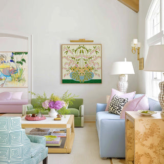 a well-decorated living room with a mix of colorful furniture and artwork on the walls.